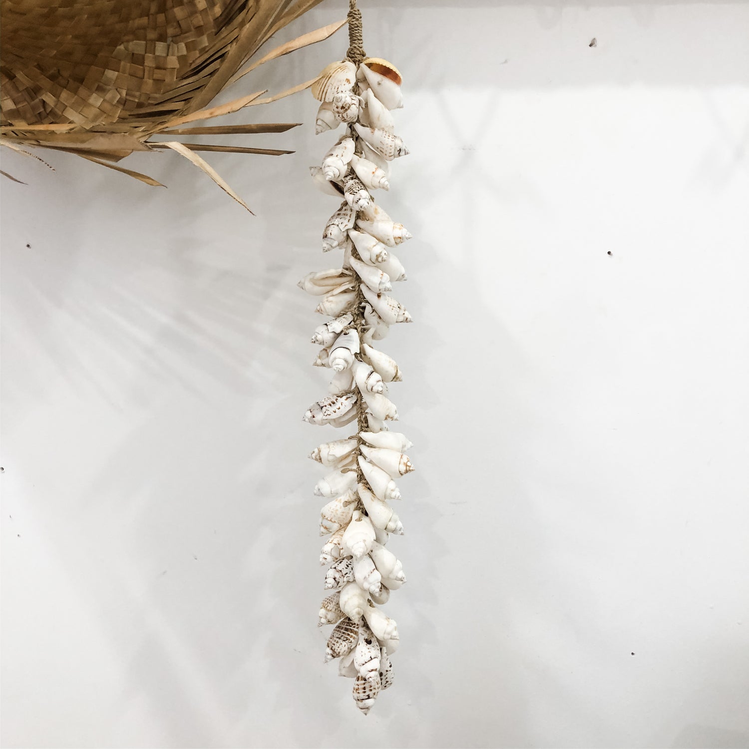 Spike Shell Tassel featuring white and beige shells