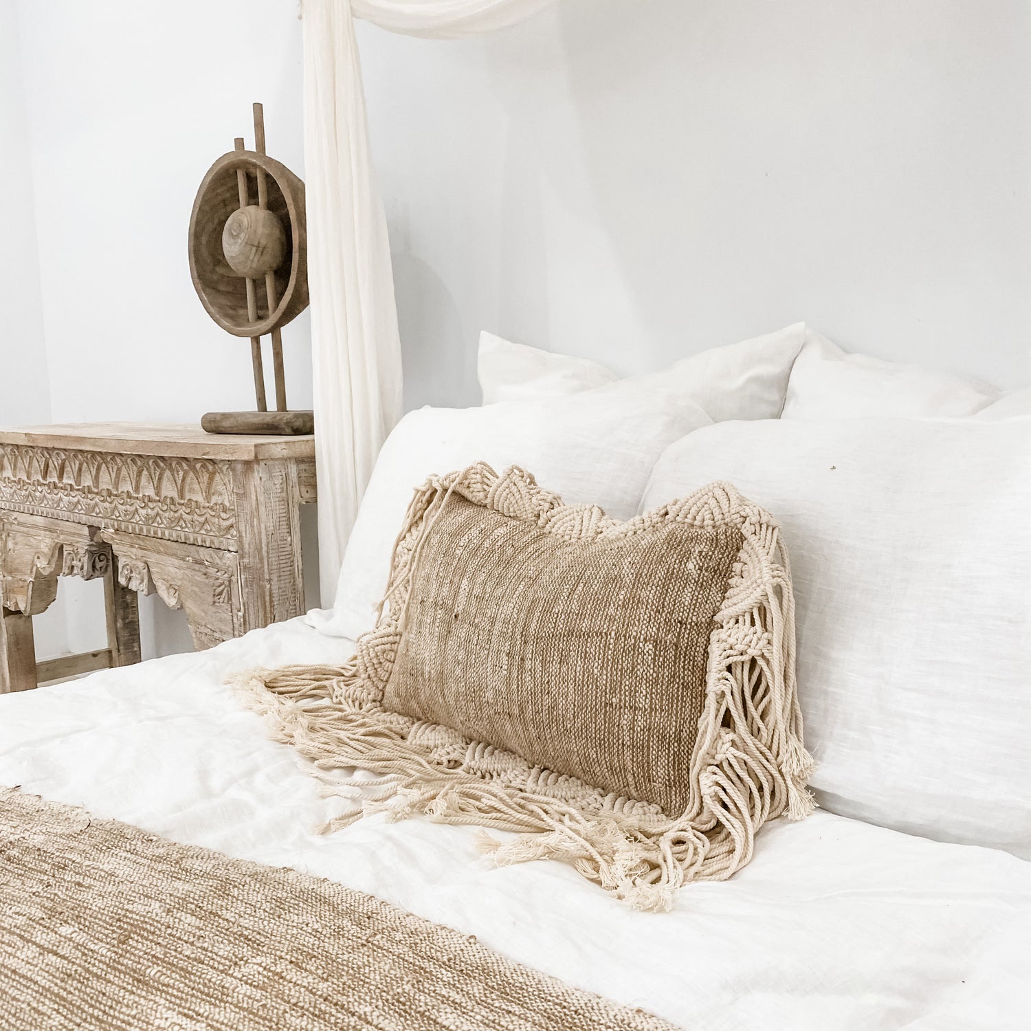Summer Breeze Cushion featuring natural cotton and jute base with macrame fringe